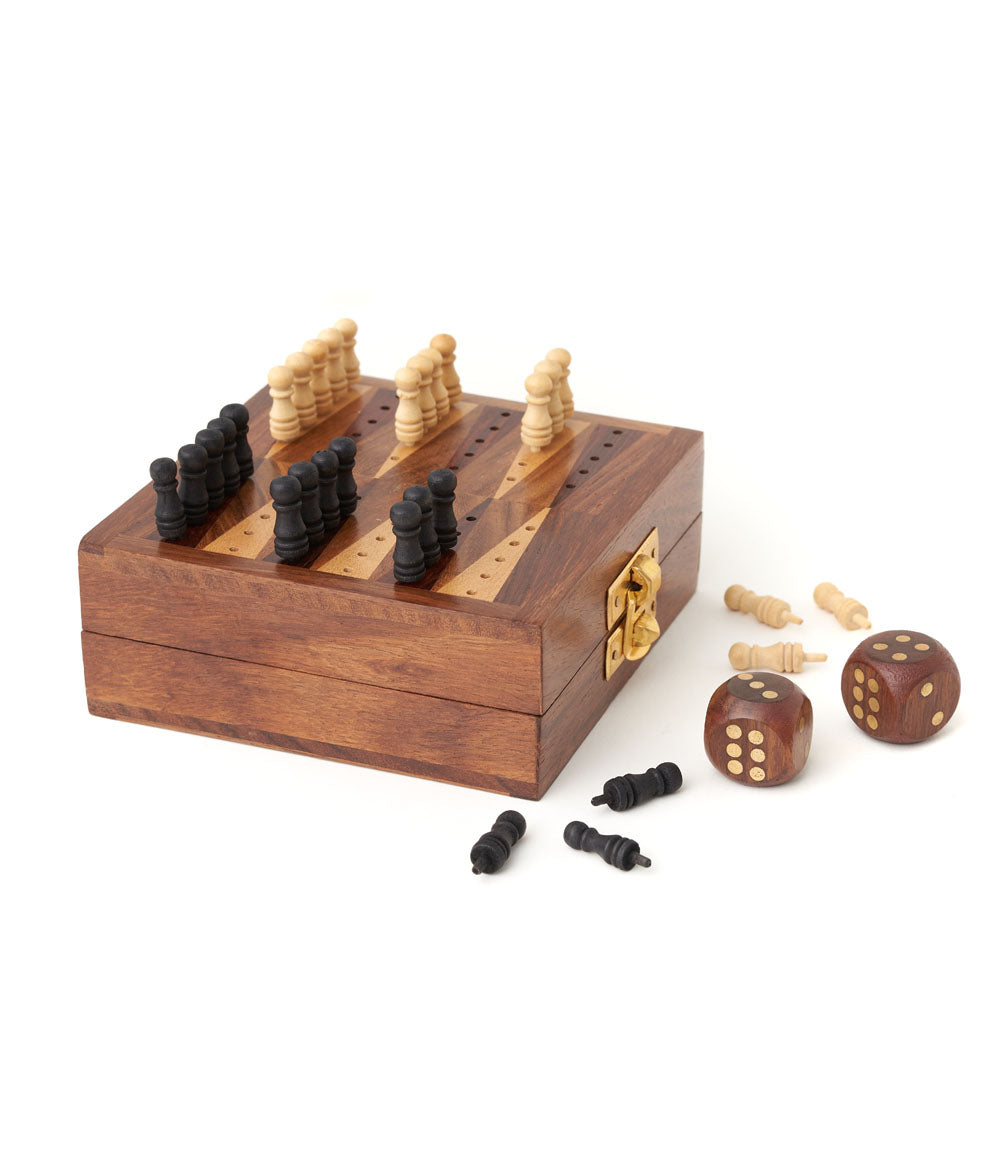 Mini backgammon travel wooden case with open board, checkers and wooden dice beside it