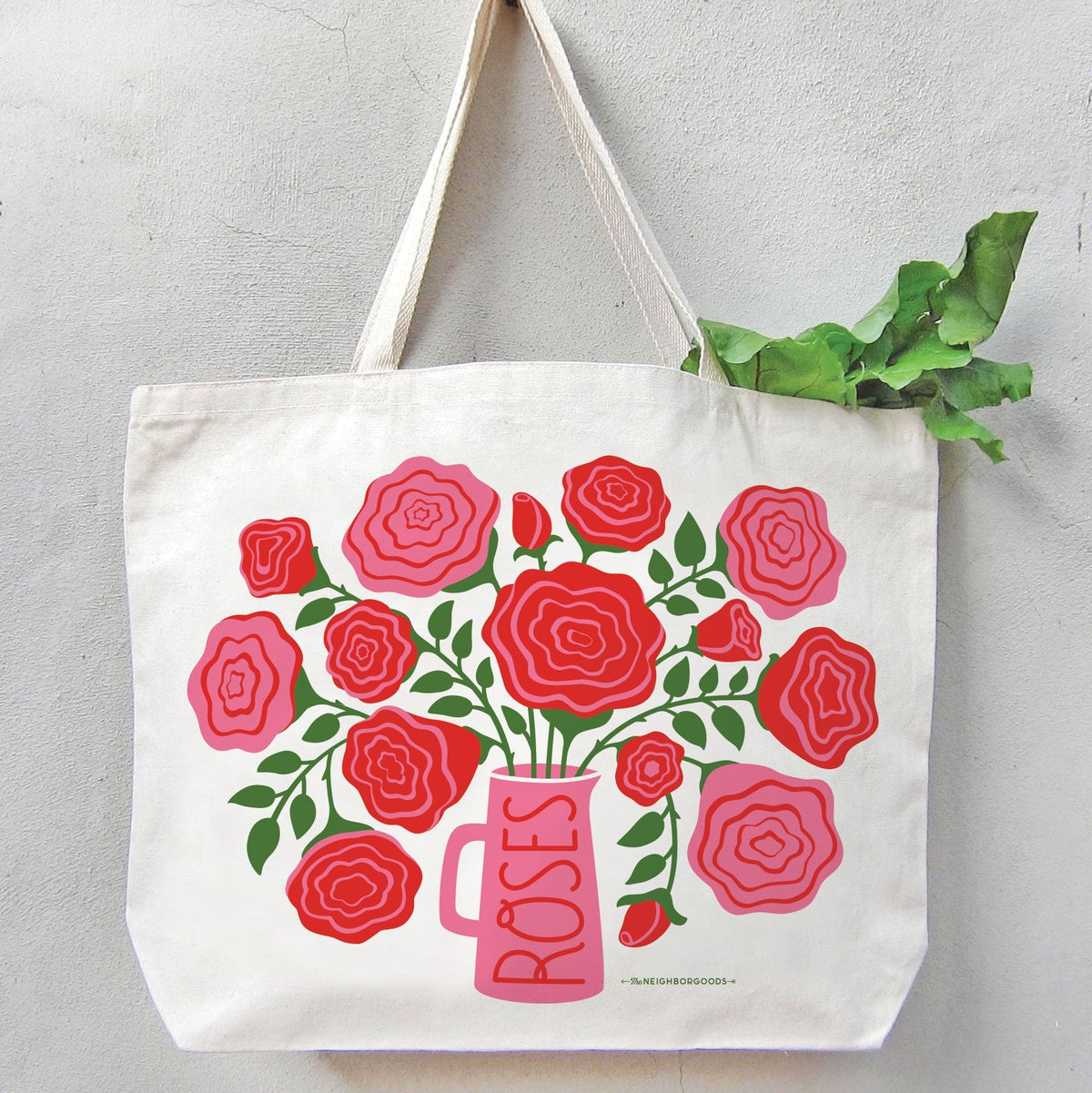 Off-white canvas tote bag featuring red and pink rose bouquet with pink vase graphic