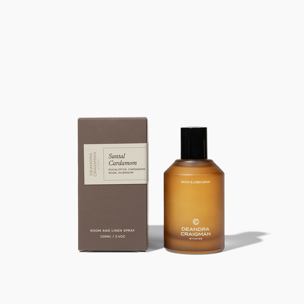 Amber room and linen spray bottle with black cap and matching product box