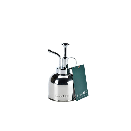 Stainless steel indoor plant mister with curved spout and handle, plus green gift tag