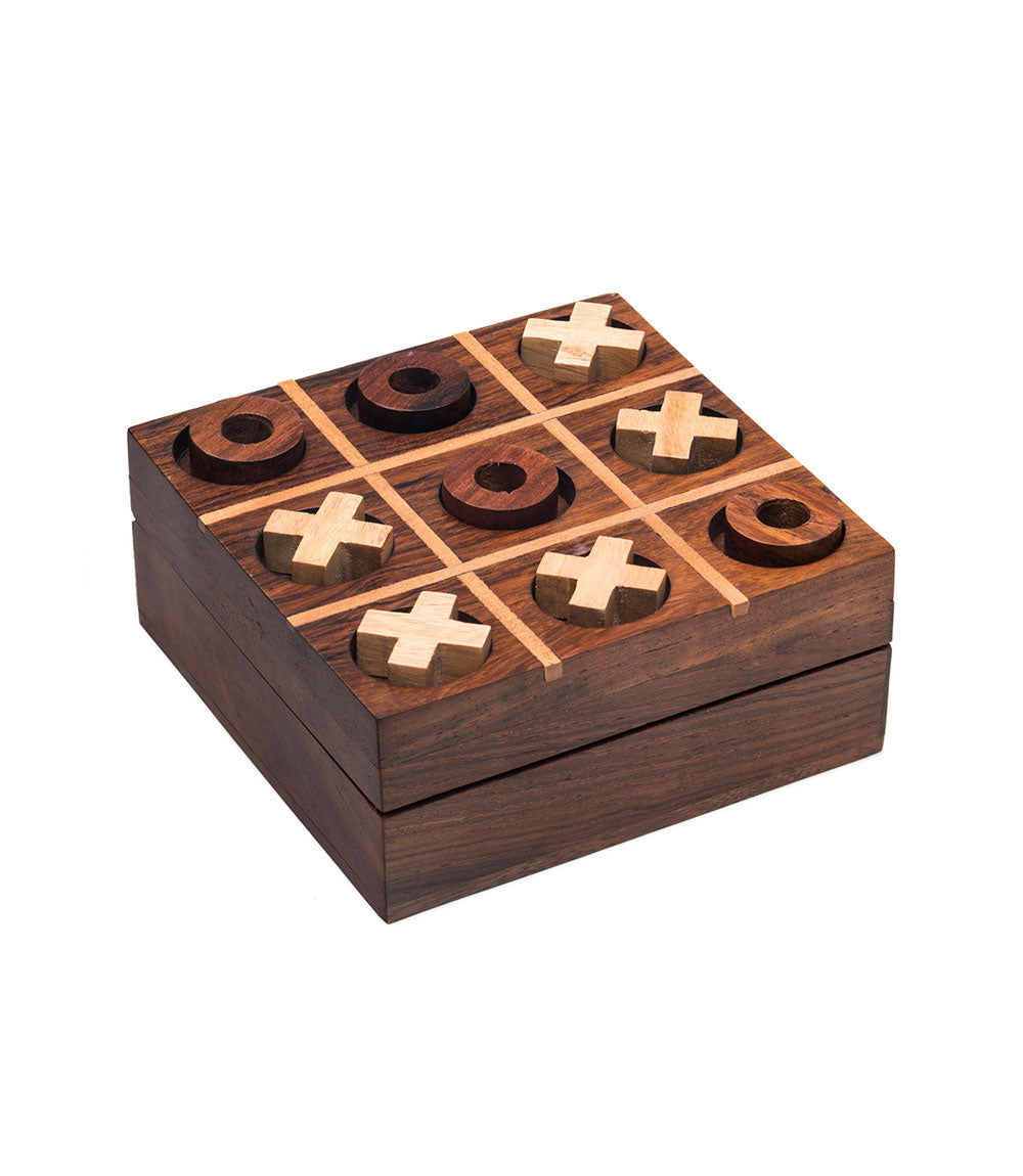Wooden tic-tac-toe board top view with crosses and rings fitted into carved squares.