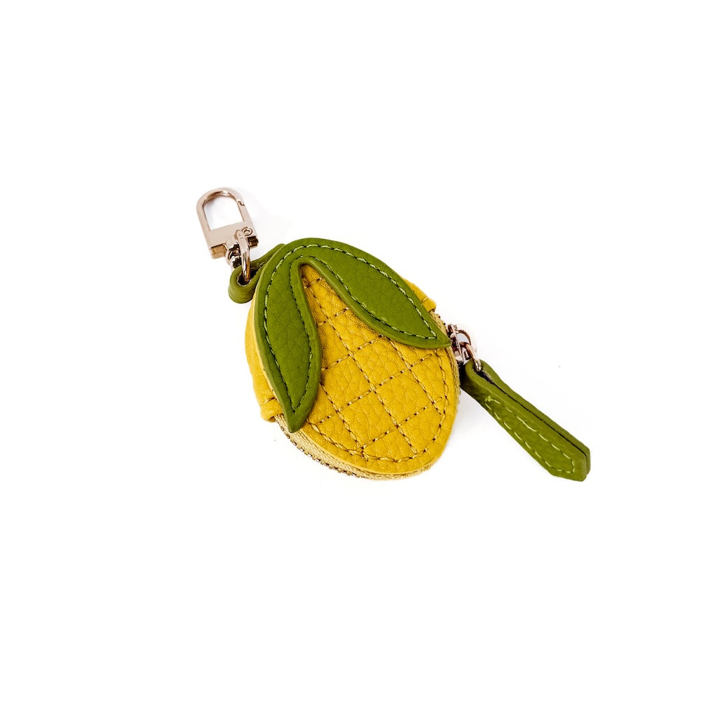 Lemon slice-shaped fabric keychain charm with green strap and metal clasp