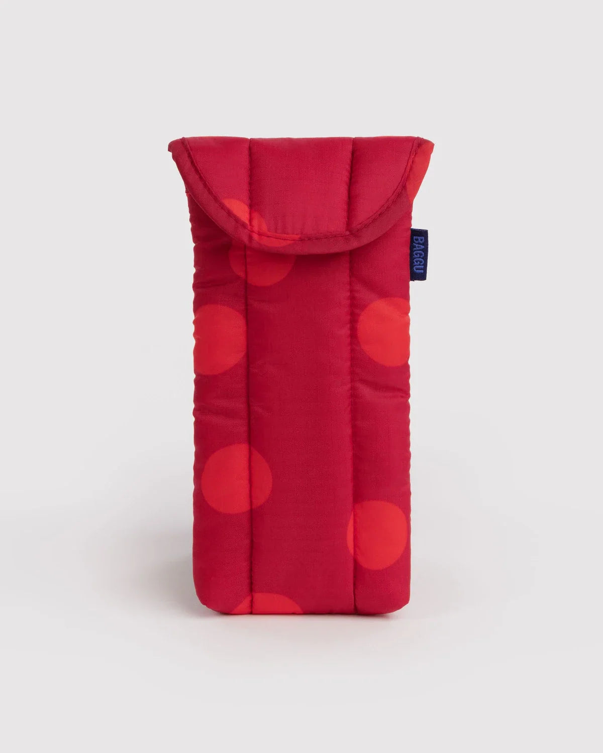 Baggu puffy glasses sleeve in red with large polka dots and a flap closure