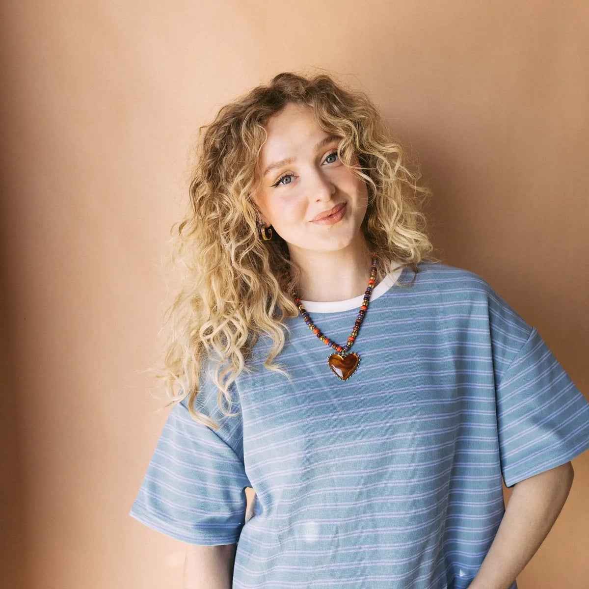 Amber beaded heart necklace worn at the neckline