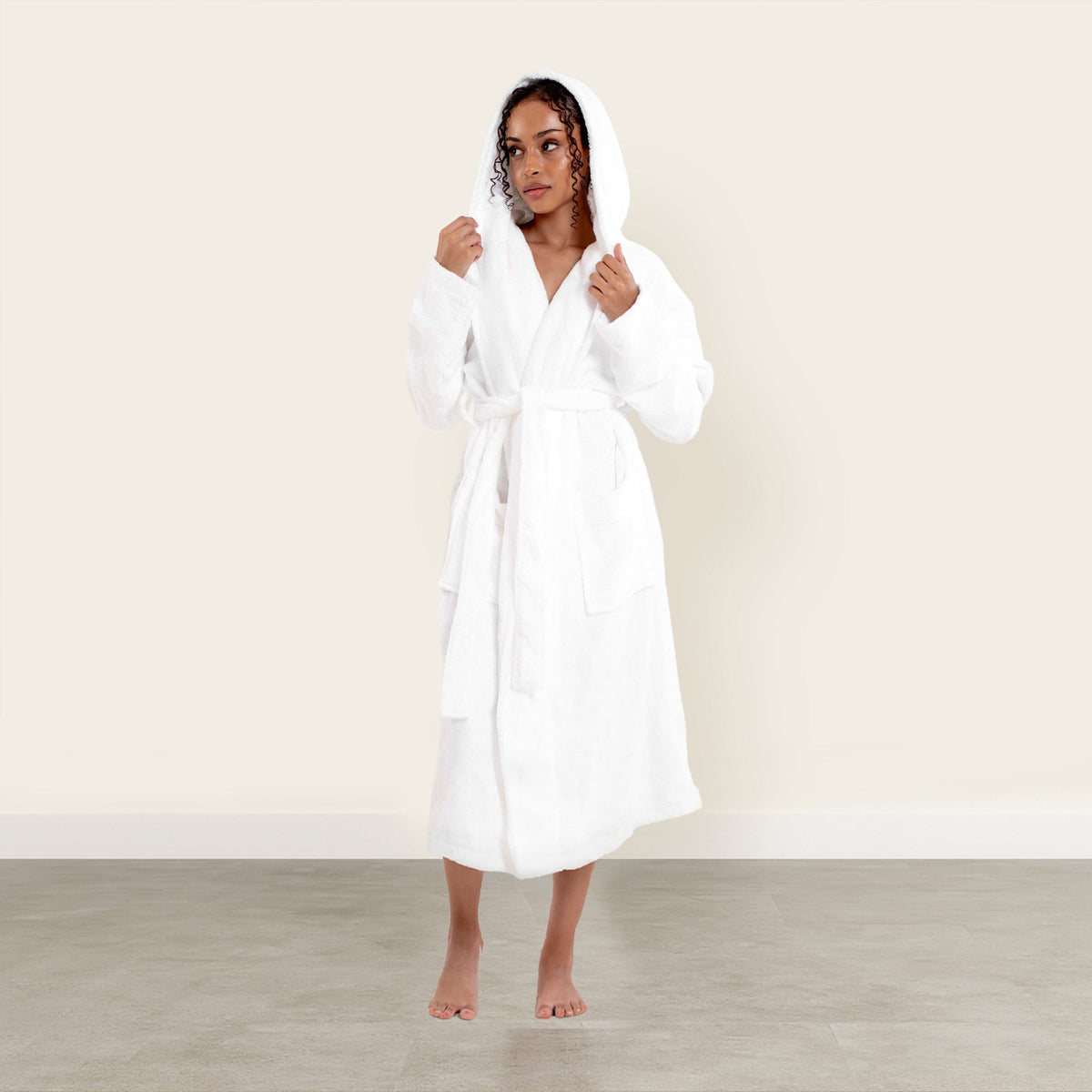 Unisex plush white hooded cotton bathrobe with belt tie, mid-calf length