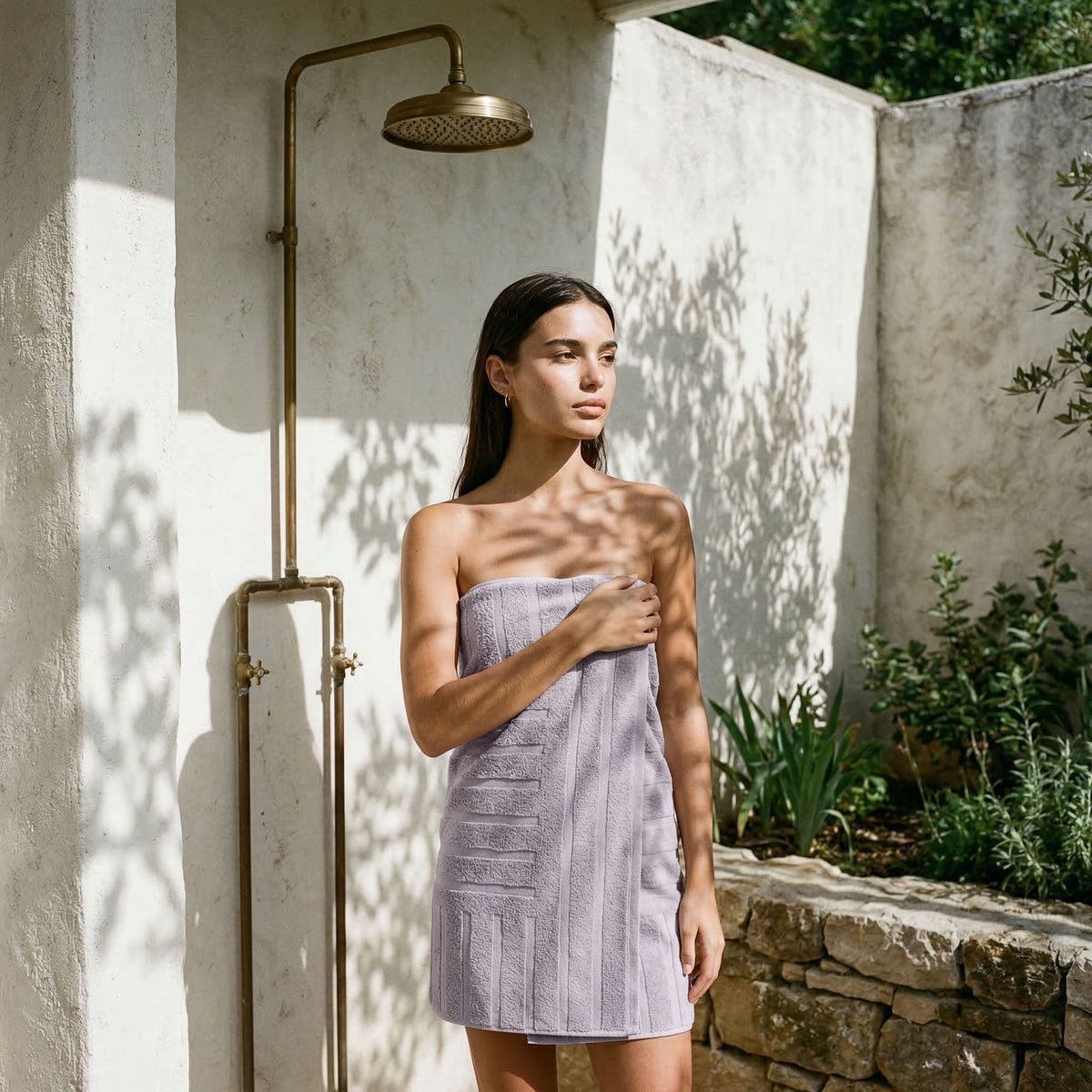 Lavender textured cotton towel wrap, secured at the shoulder with a strap