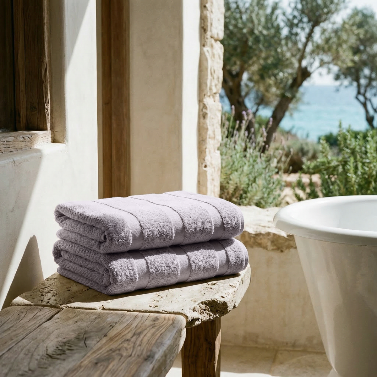 Australian cotton towels, lilac, neatly folded stack