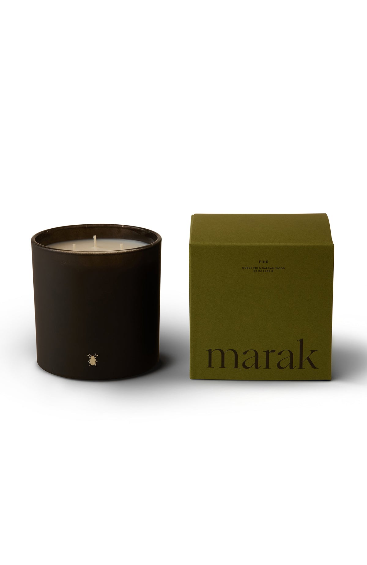 Small dark marak pine candle with green presentation box