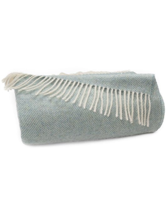 Robin's egg blue herringbone wool throw, folded with cream fringe