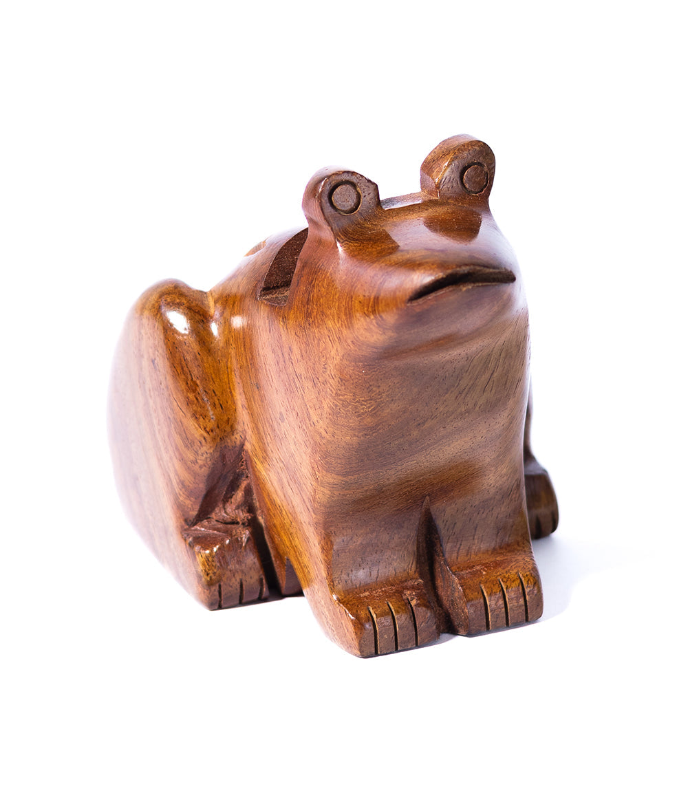 Hand-carved wooden frog eyeglass stand with rounded body and carved eyes