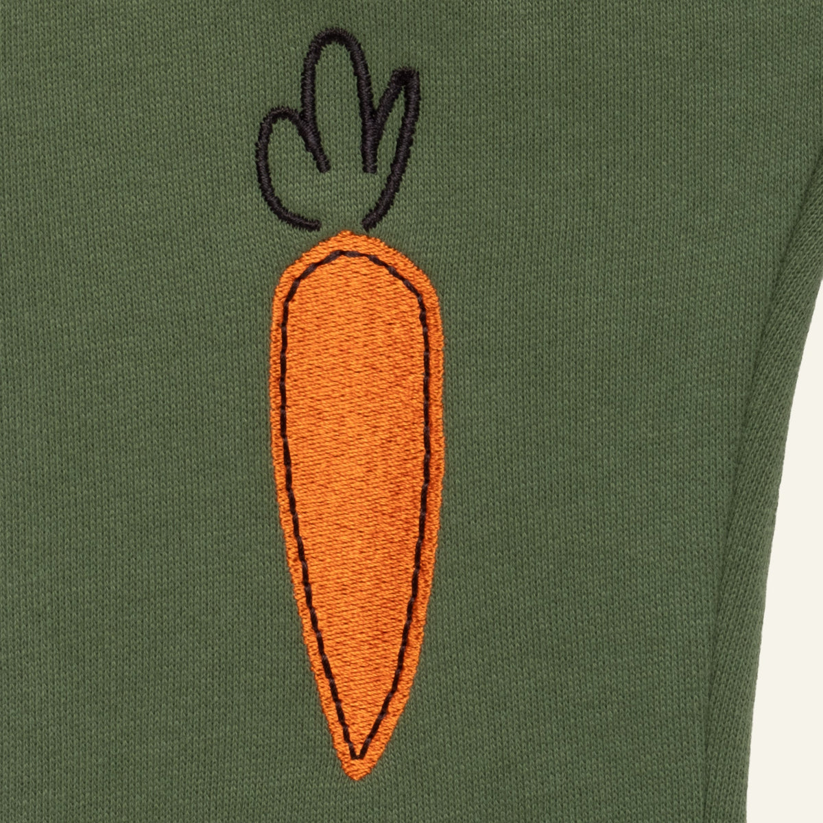 Embroidered carrot on green baby jogger