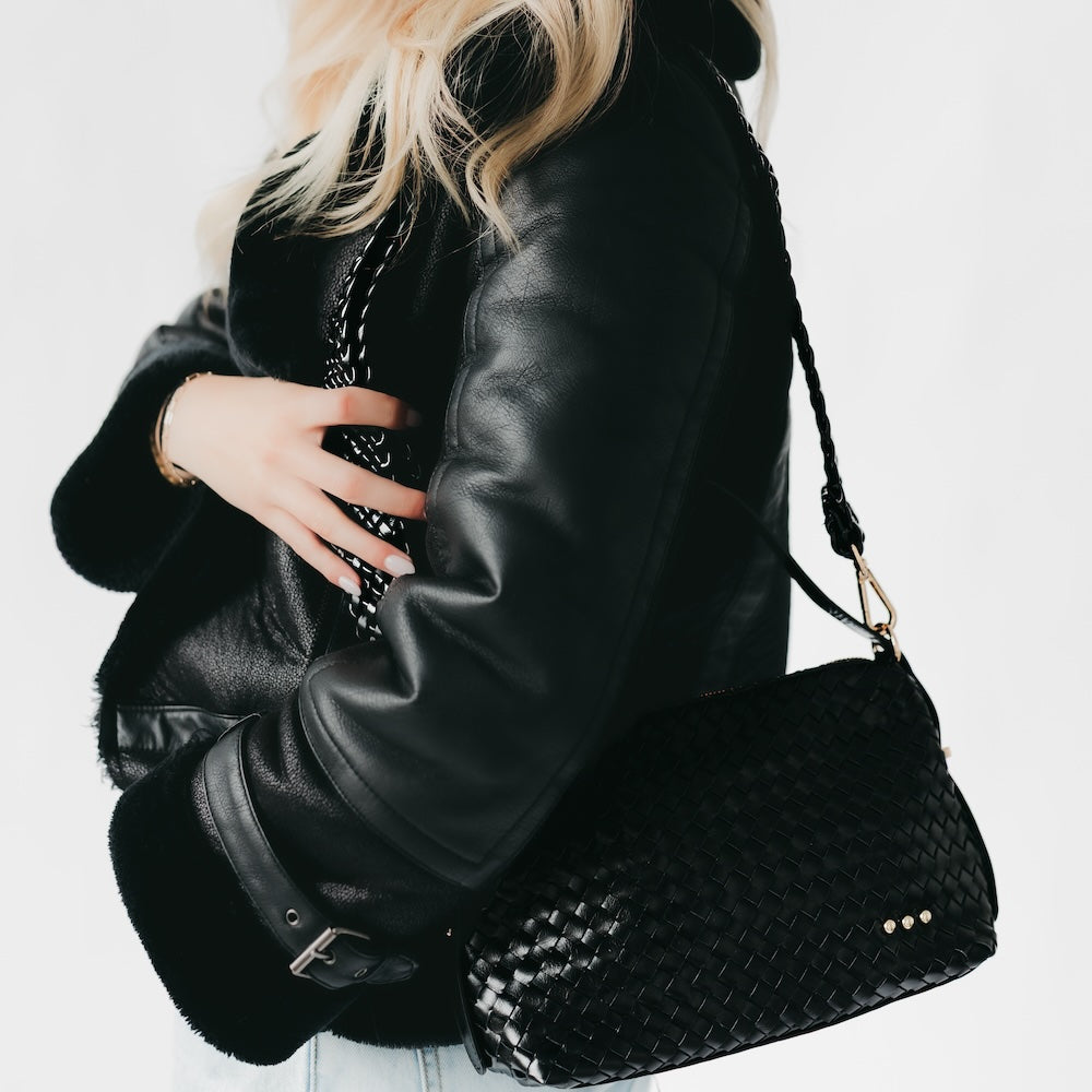 Braided strap with gold-tone hardware detail, shown on shoulder