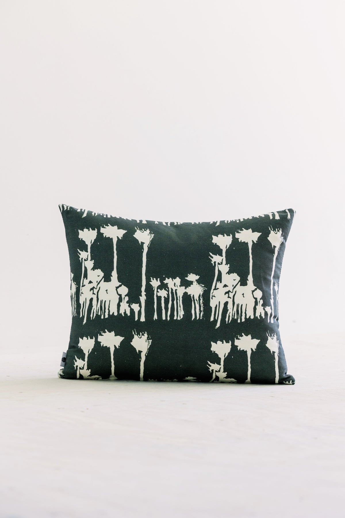 Green and white 16x20 decorative pillow with vertical animal silhouette pattern