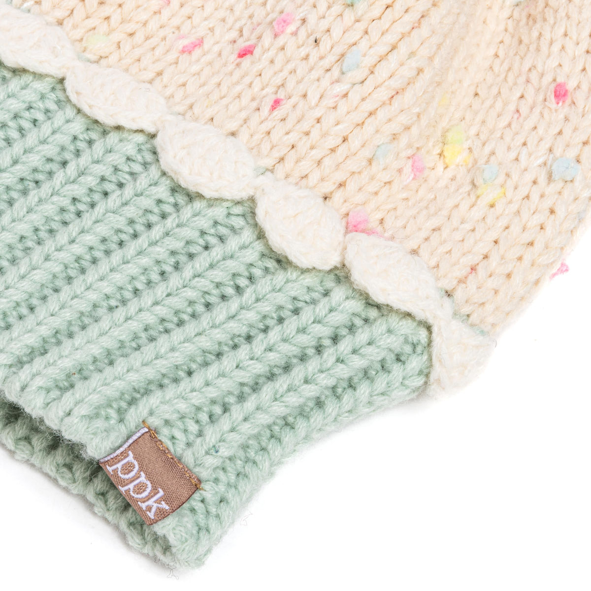 Mint green ribbed beanie brim with cream scalloped trim and speckled knit crown.