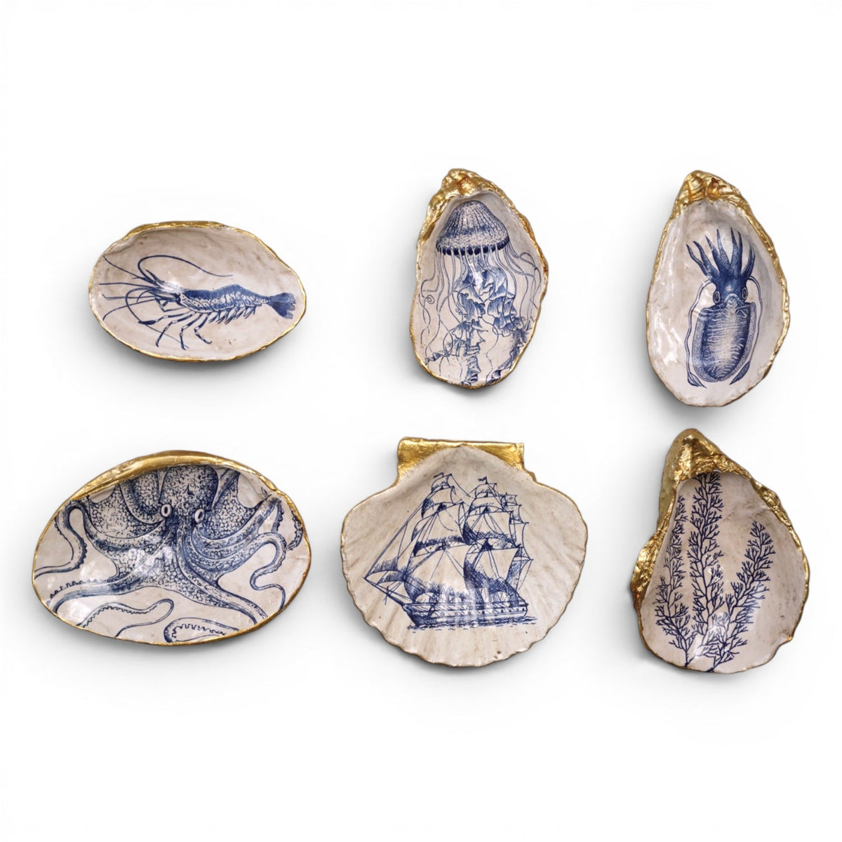 Set of six blue sea-life shell trinket dishes with gold edging, assorted shapes