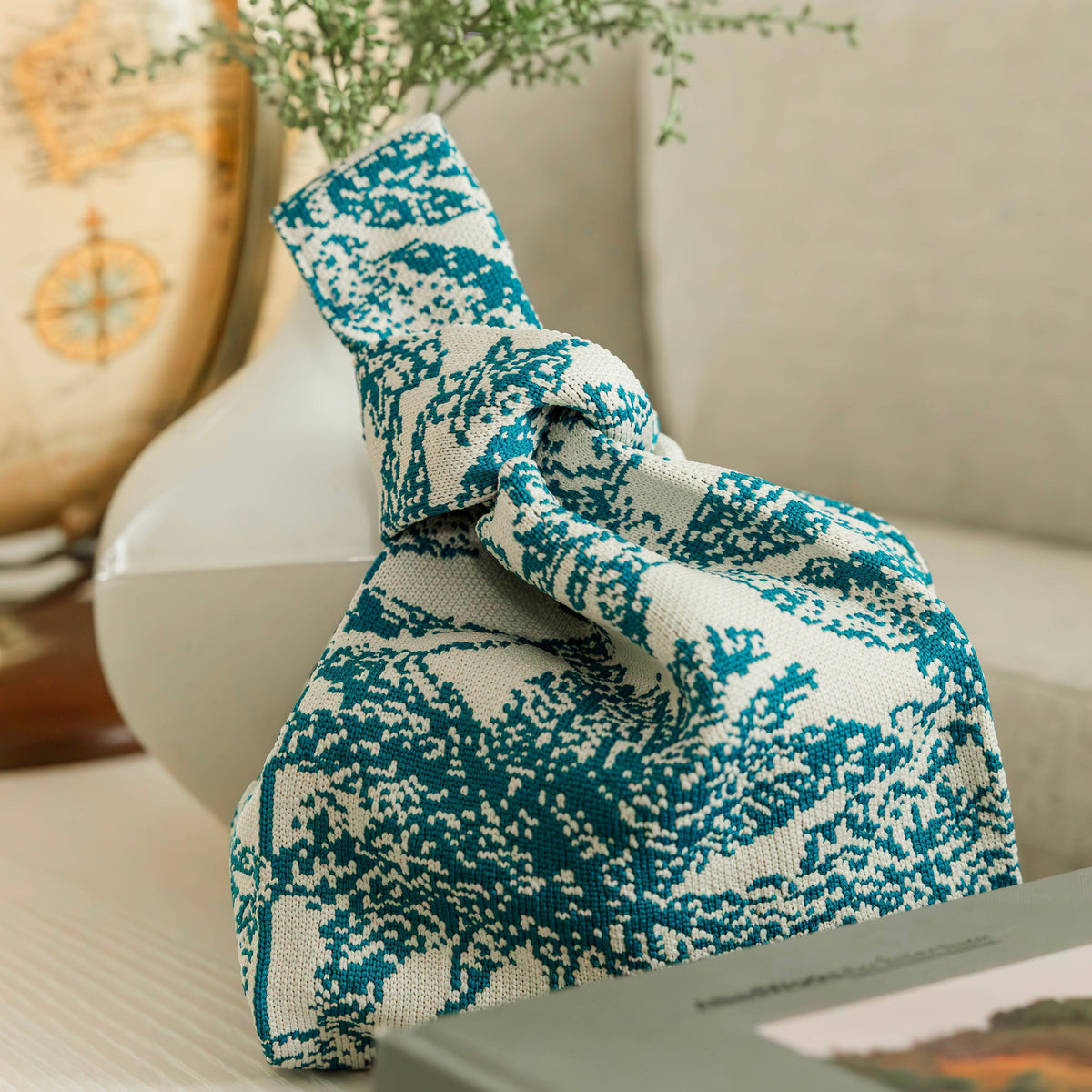 Blue and white woven drawstring handbag pouch with bow-tied top and gathered sides