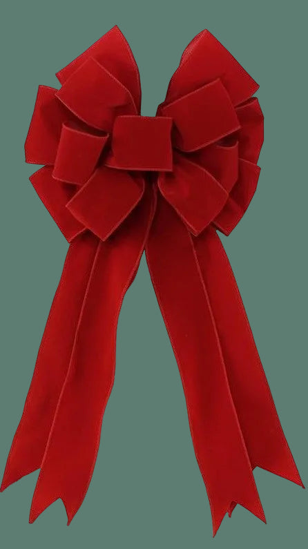 Red velvet bow with wired edge and long ribbon tails.