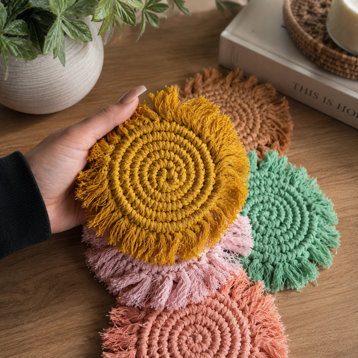 Mustard yellow braided rope tassel coaster with circular braid center and fringe tassels