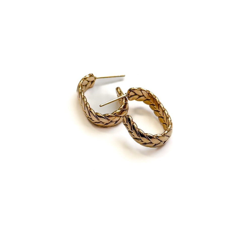 Gold braided oval hoop earrings with stud post backs.