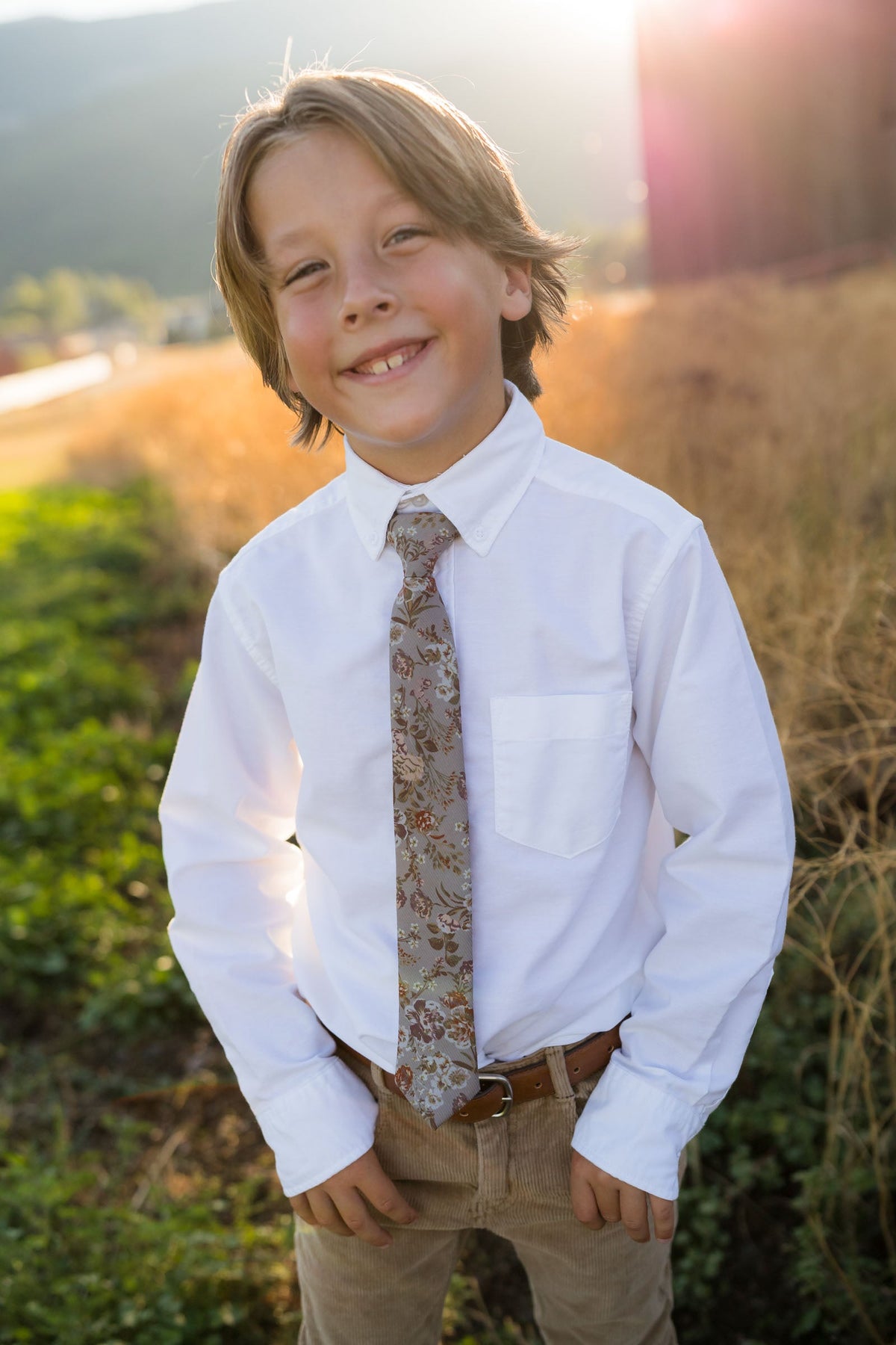 Briar Rose boys tie worn with white button-down shirt; floral pattern