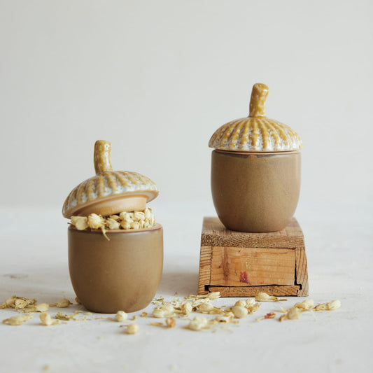 Two stoneware acorn jars with speckled lids and acorn knobs, brown tan finish