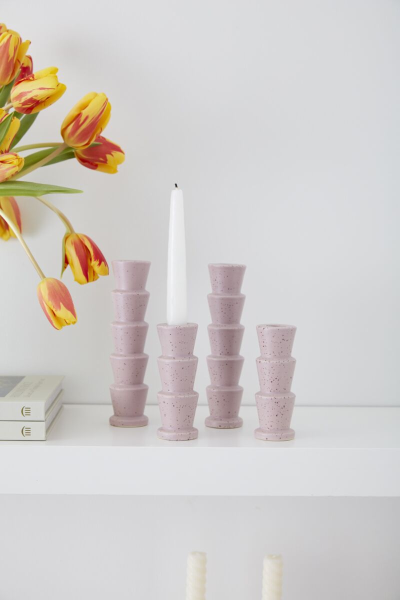 Pink speckled taper candleholder set with 5 cups holding taper candles