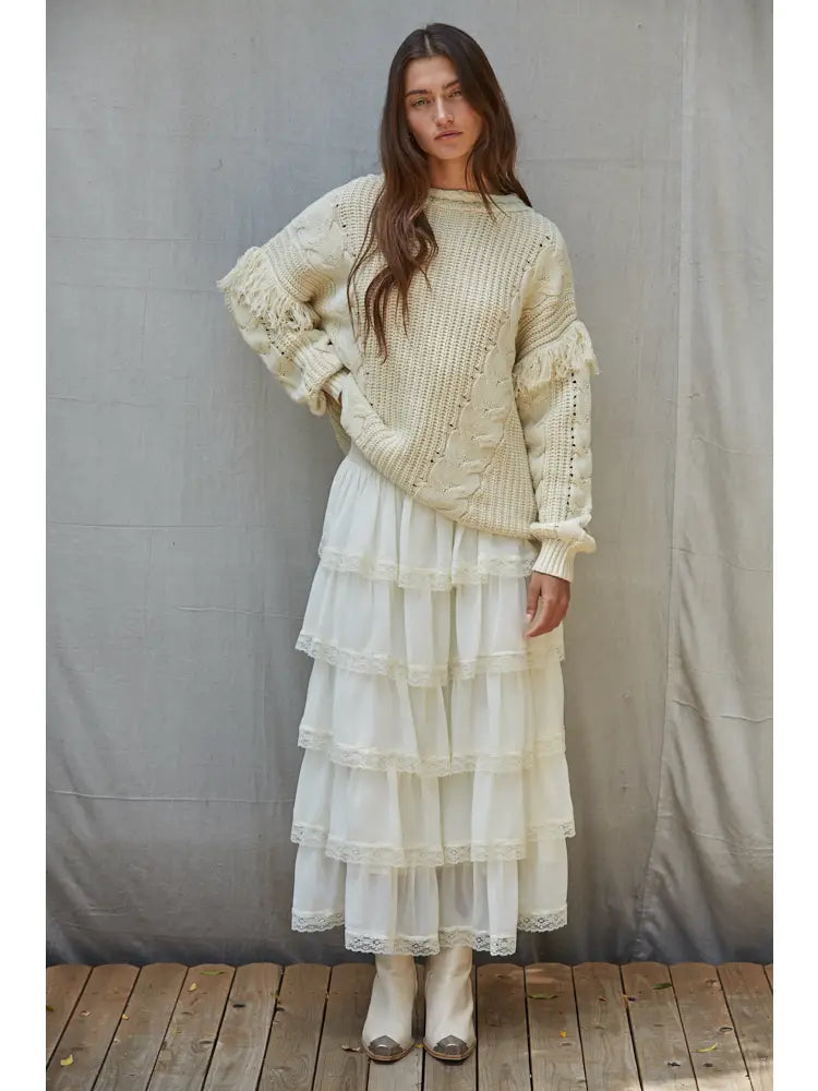White tiered maxi skirt with sheer ruffled layers and delicate lace trim