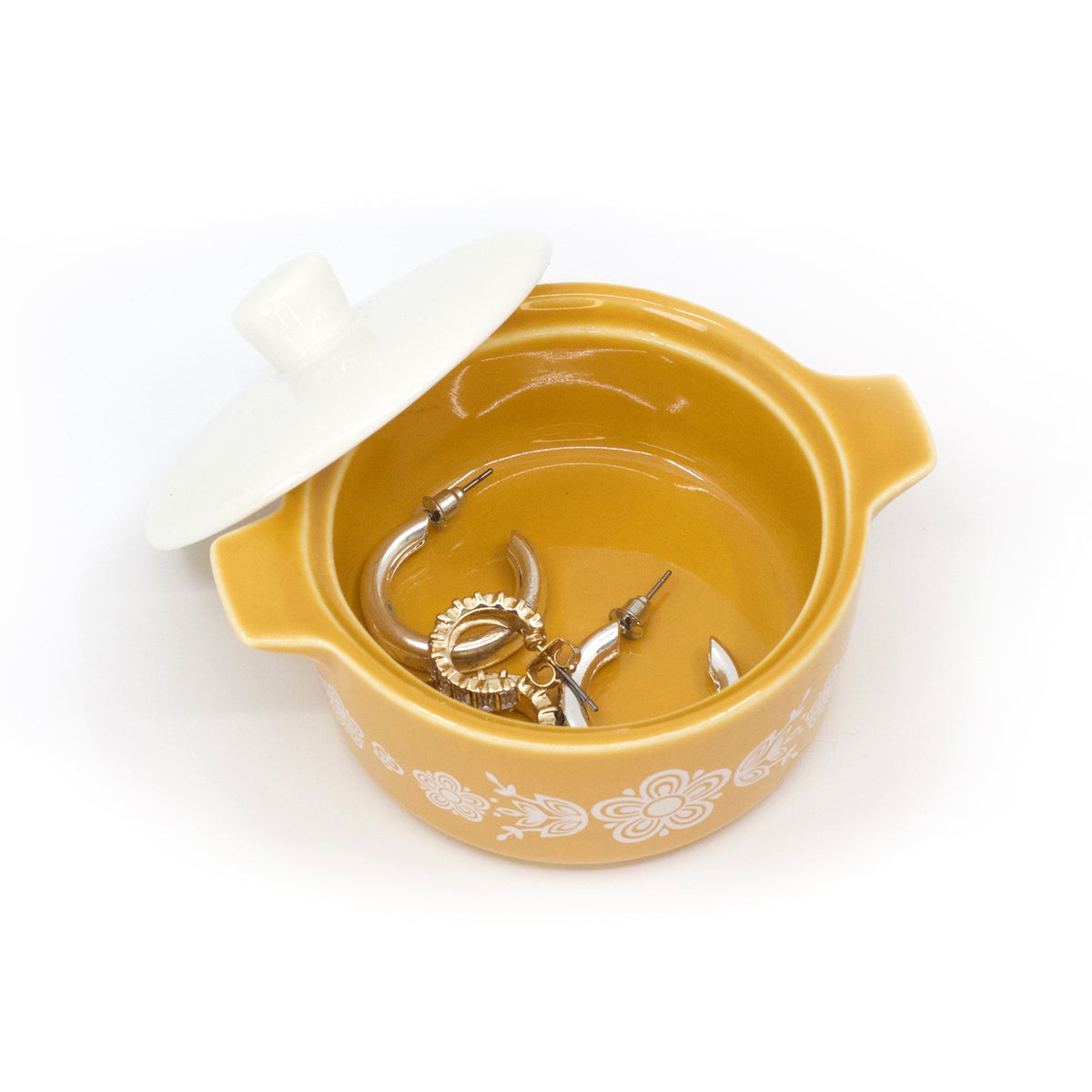 Yellow ceramic casserole trinket box with lid off, showing inner metal trinket tools