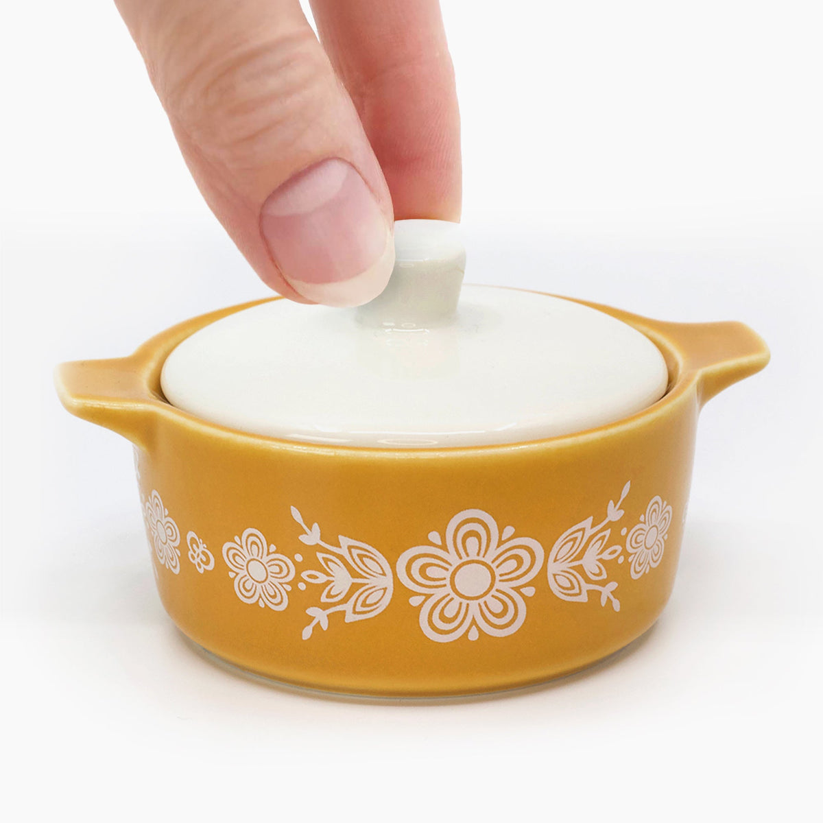 Yellow ceramic casserole trinket box with white lid and white floral butterfly pattern
