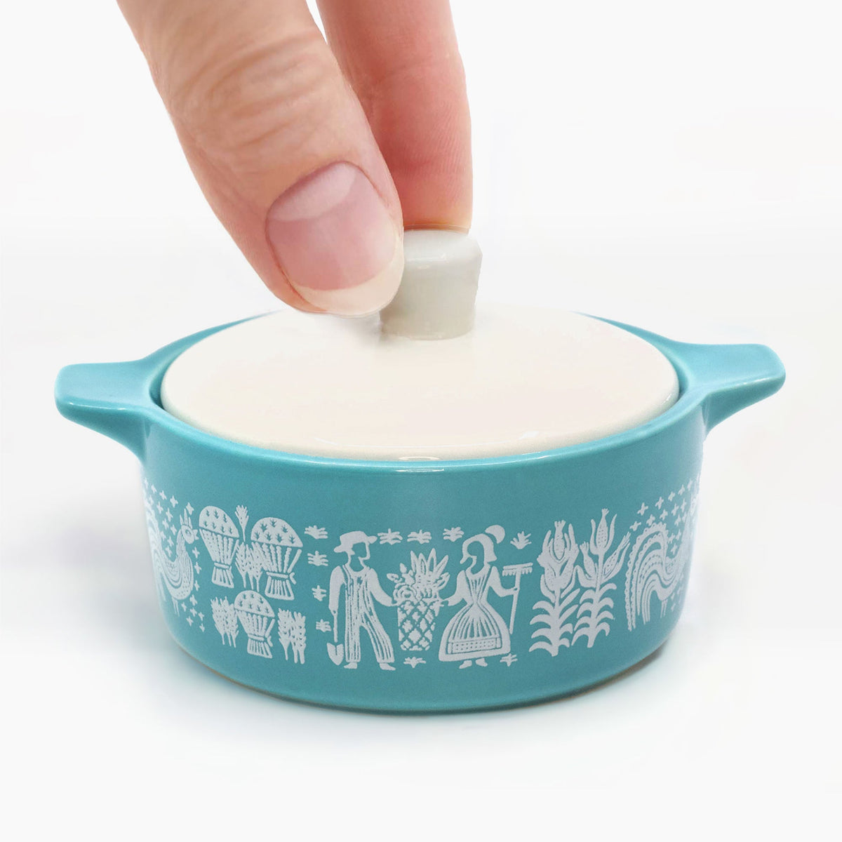 Blue ceramic casserole trinket box with white lid and raised handle detail