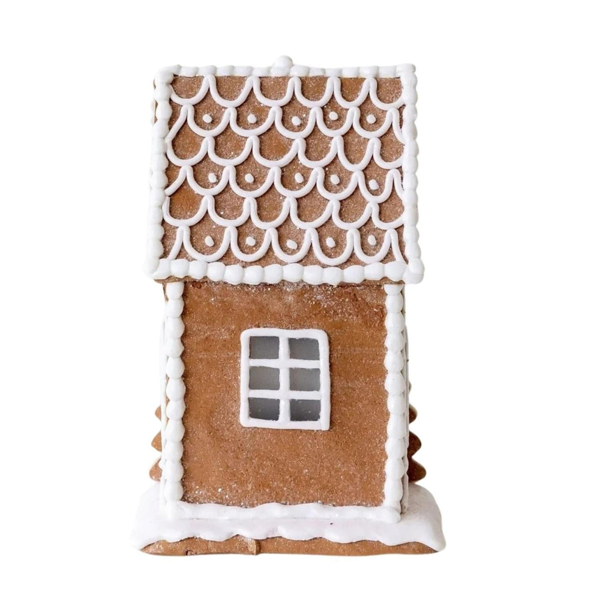 Lighted gingerbread house with white scalloped roof icing and square front window