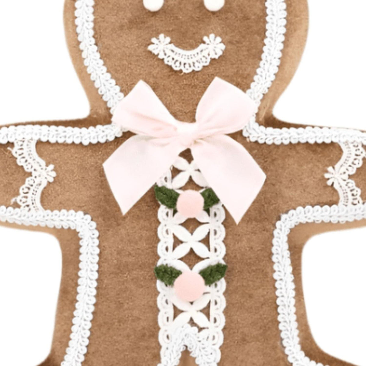 Gingerbread boy ornament close-up: brown felt, white lace edging, pink bow, green center