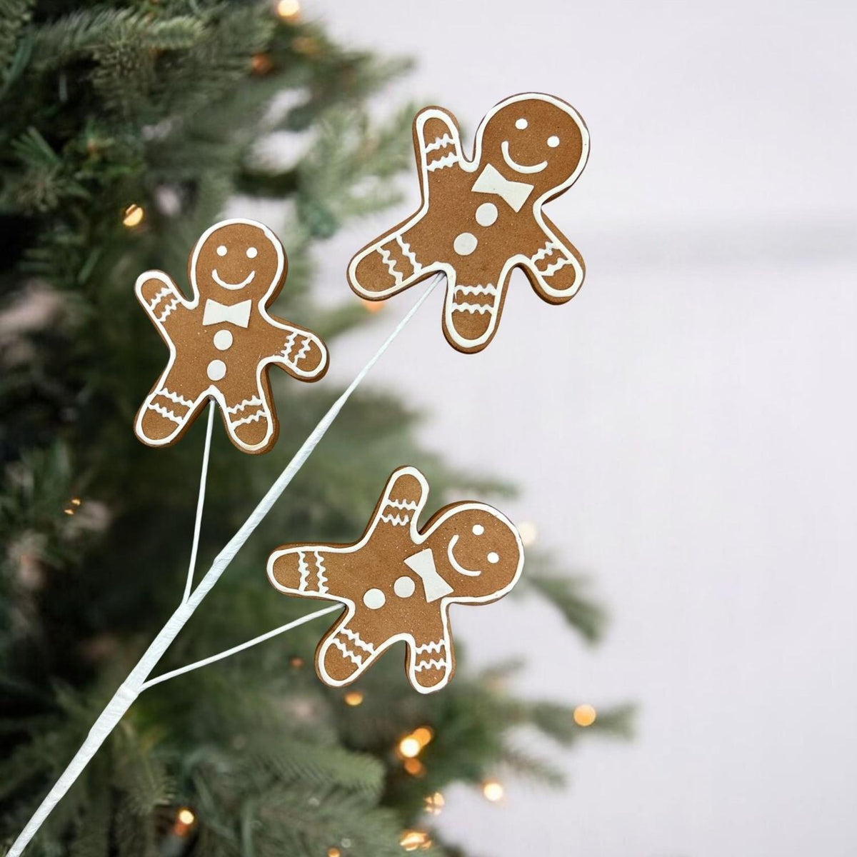24-inch gingerbread cookie decoration spray with four gingerbread figures on thin stems