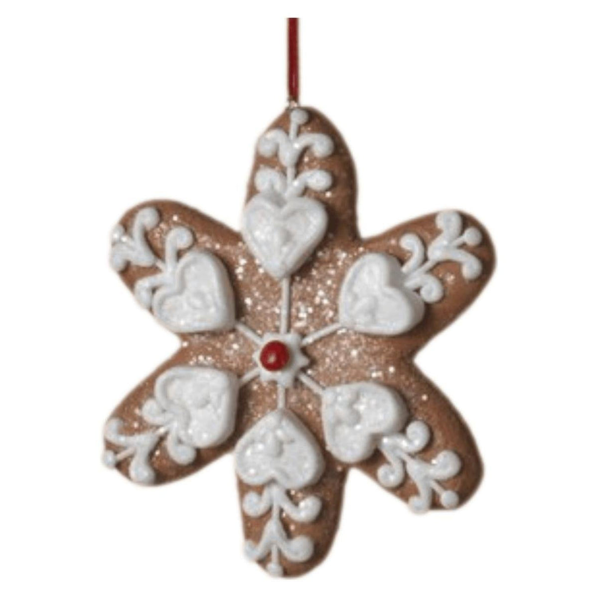 Star-shaped clay dough ornament with white icing hearts and a red center dot