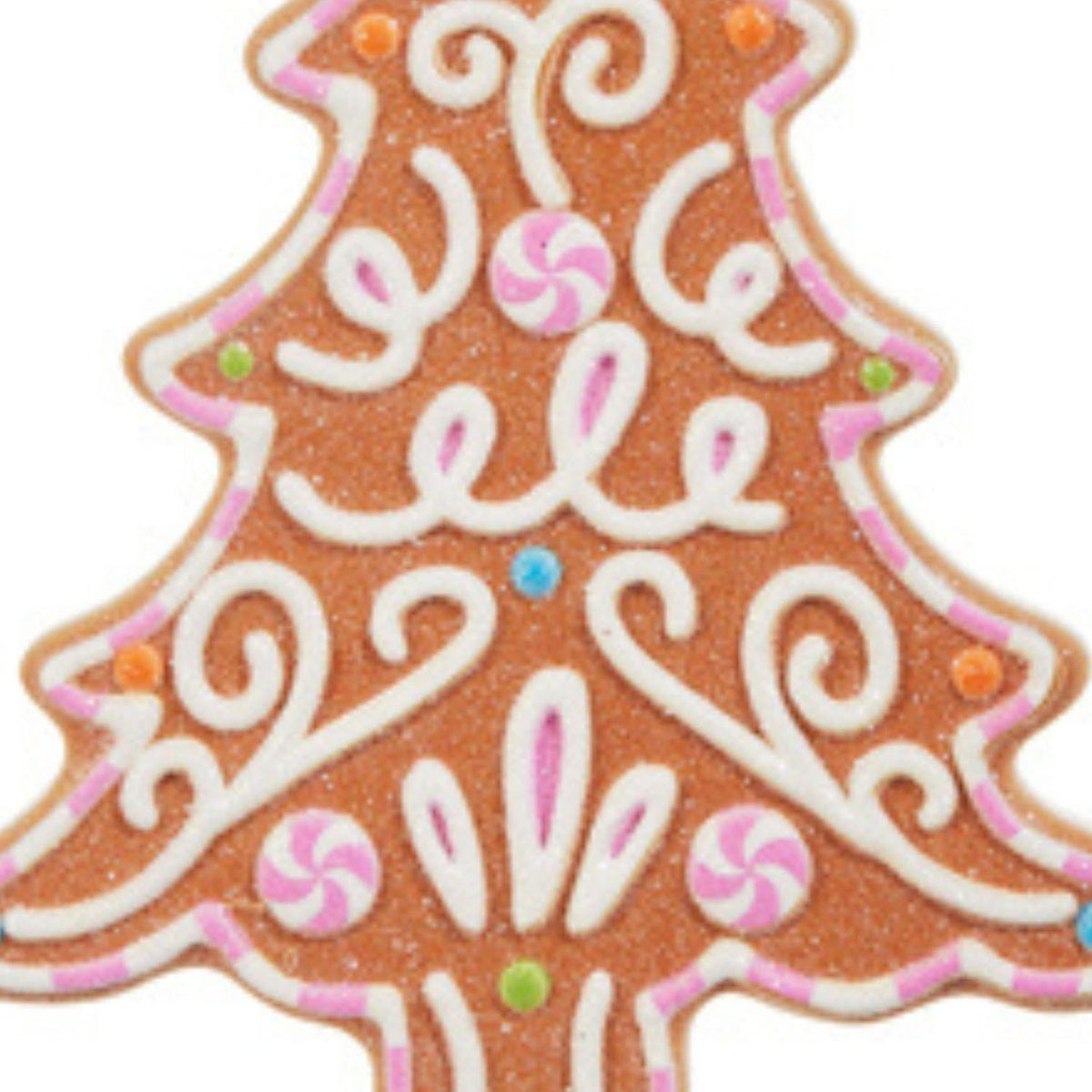 Gingerbread tree ornament close-up with orange-brown icing, white swirls and pink candies