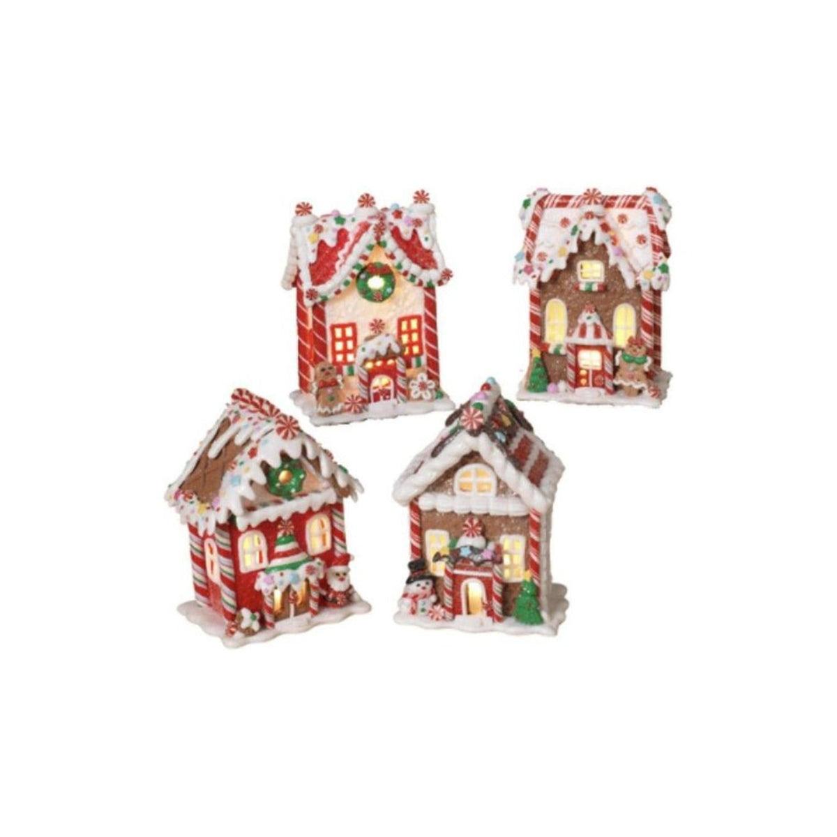 Set of miniature gingerbread-style houses with colorful candy details and lit windows