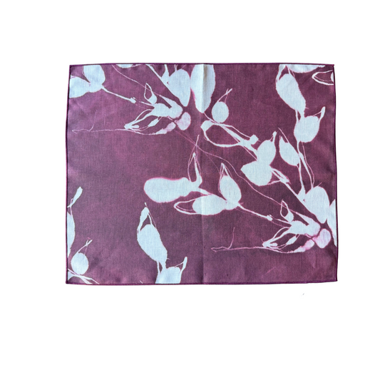Rectangular aubergine placemat with light blue botanical print and stitched border.