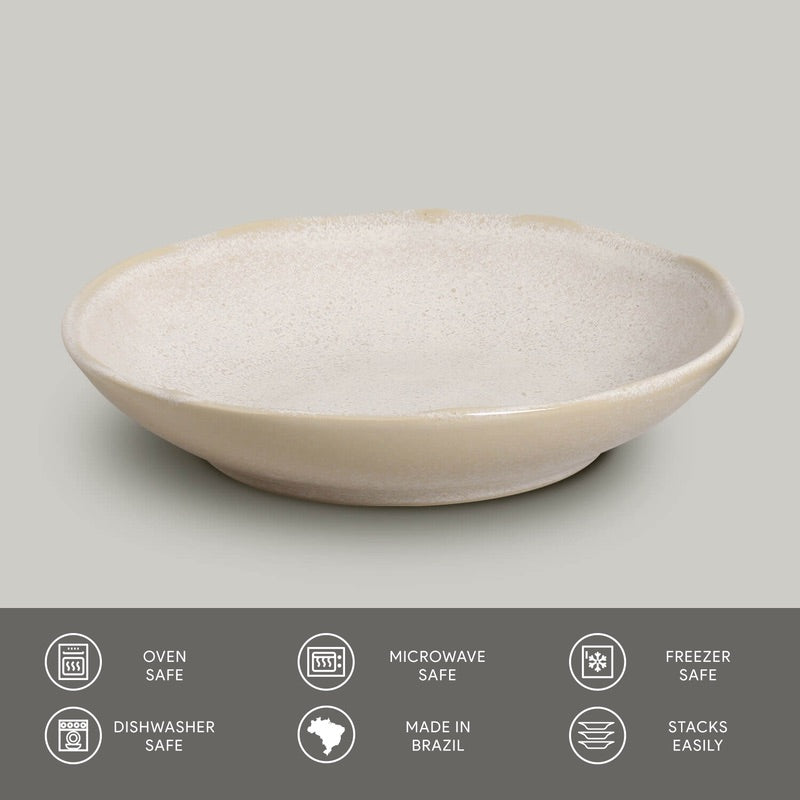 Cream-beige ceramic pasta plate with speckled reactive glaze finish