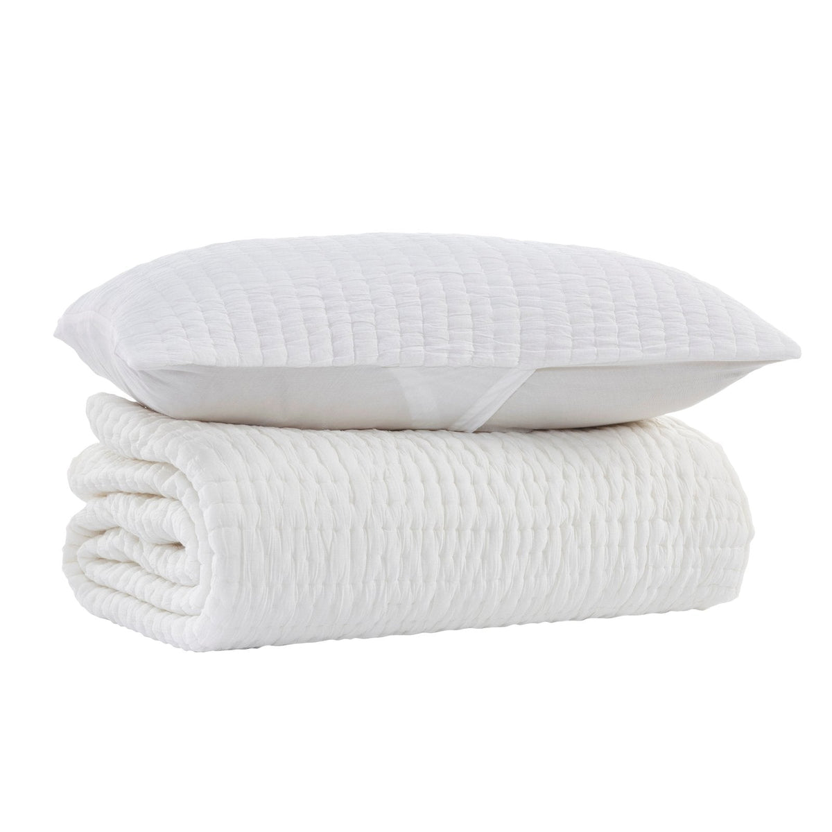 White quilt with textured quilting and a smooth edge, folded with a pillow-like top