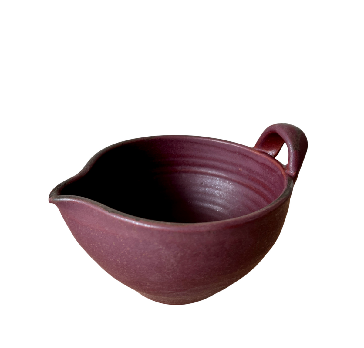 Burgundy stoneware batter bowl with side handle, speckled glaze interior