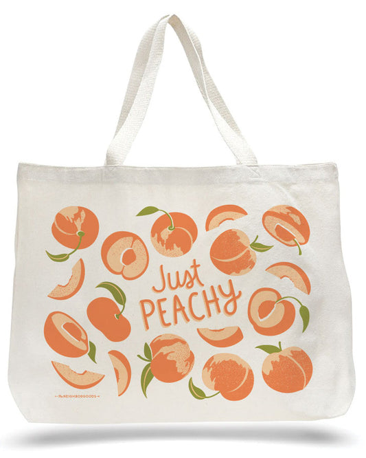 Peach canvas tote bag with green-and-orange fruit print and “Just Peachy” lettering