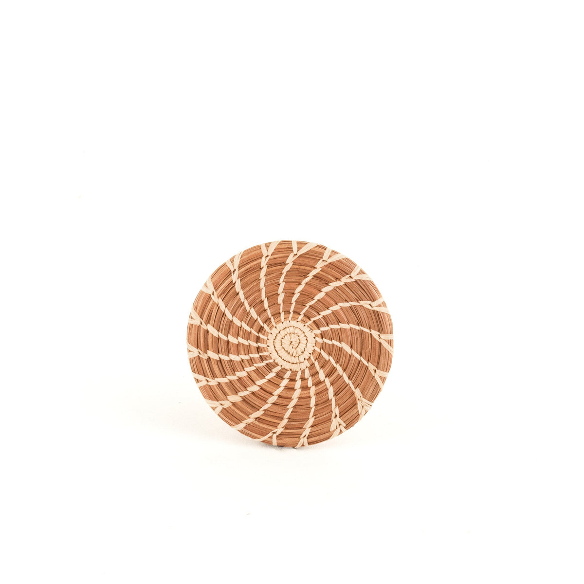 Round woven pine-needle coaster, tan with white spiral lines