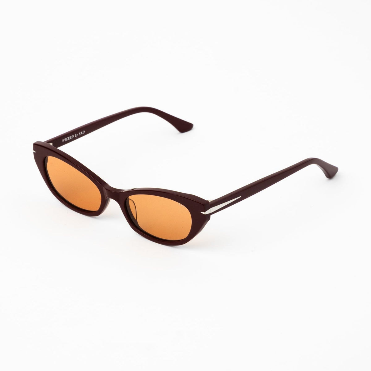 Burgundy cat-eye sunglasses with amber tinted lenses, side temple and slim arms