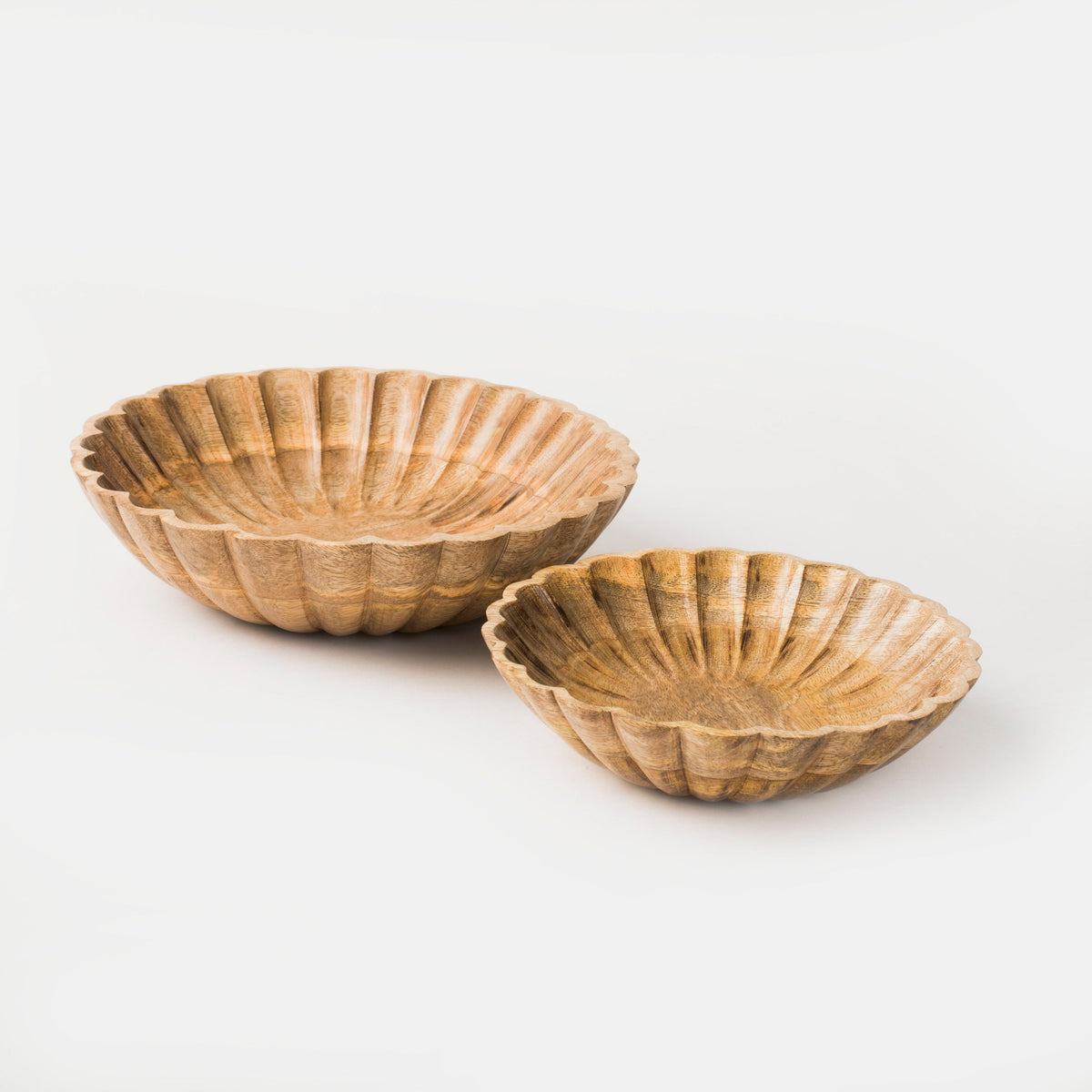 Scalloped natural wood bowls in two sizes with ridged shell edges