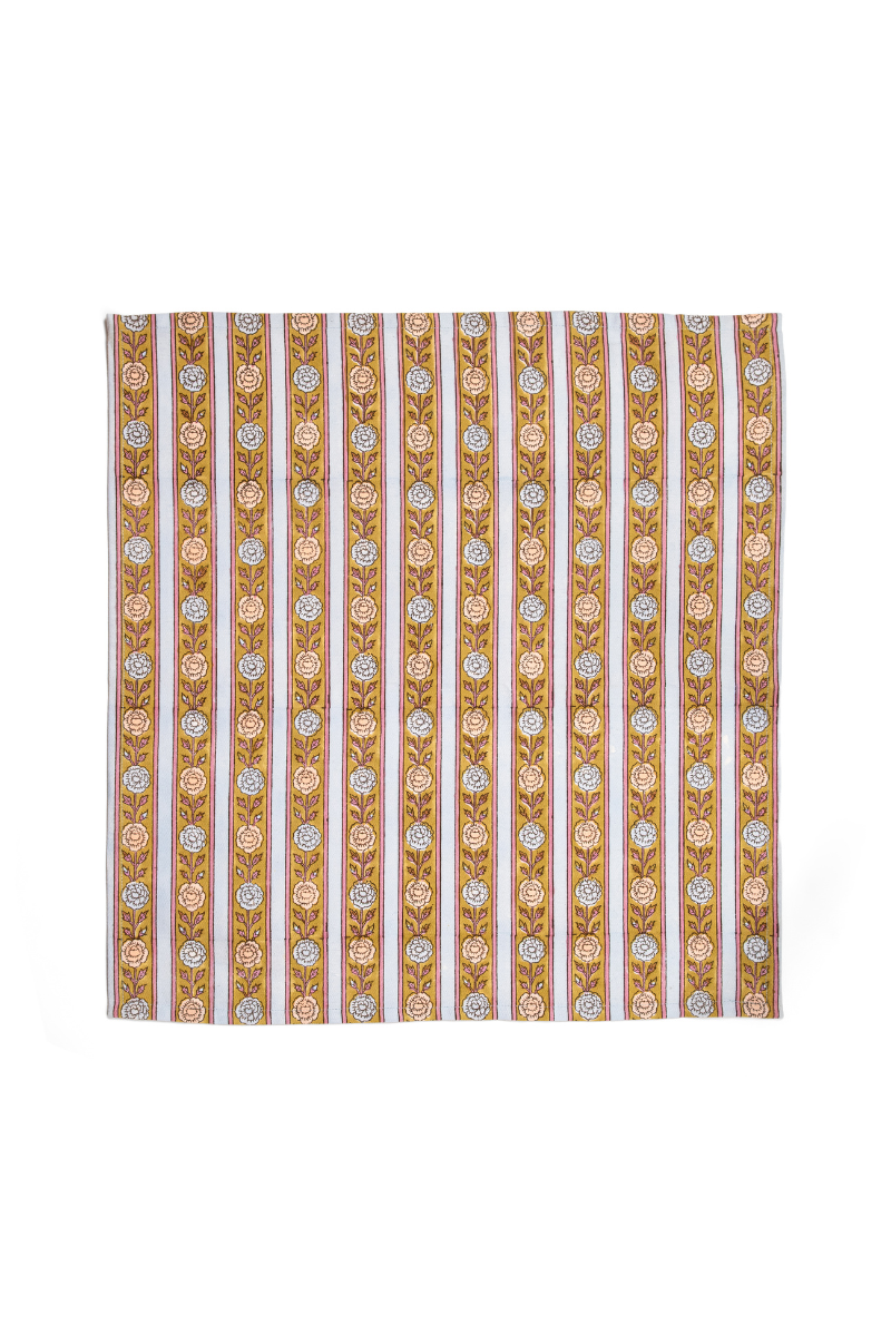 Set of 4 napkins featuring vertical stripes with repeating floral icons in blue and gold.