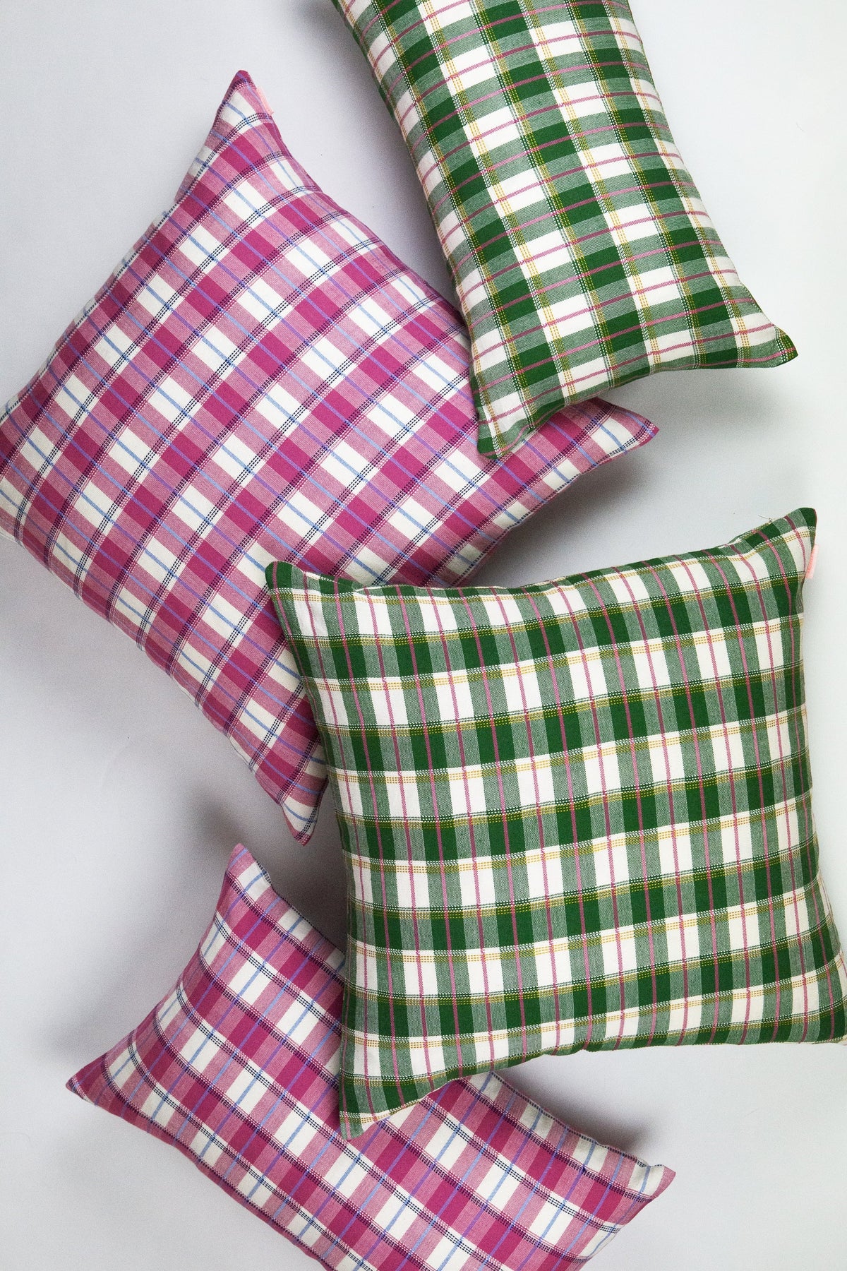Green gingham lumbar pillow angled view with visible piped edges
