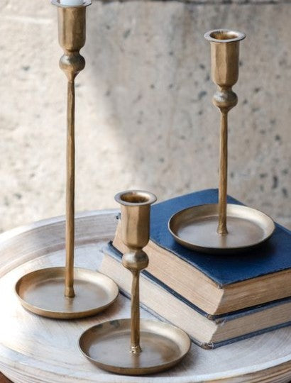 Set of 3 gold plate candle holders with wide bases and slender stems, varying heights