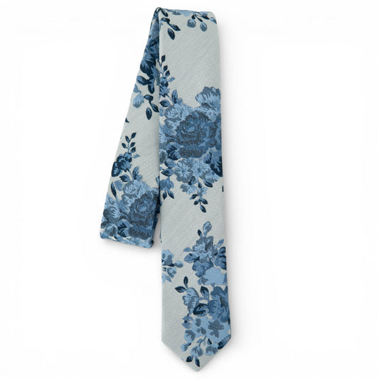 Youth floral tie in blue tones, textured weave with repeating blossoms