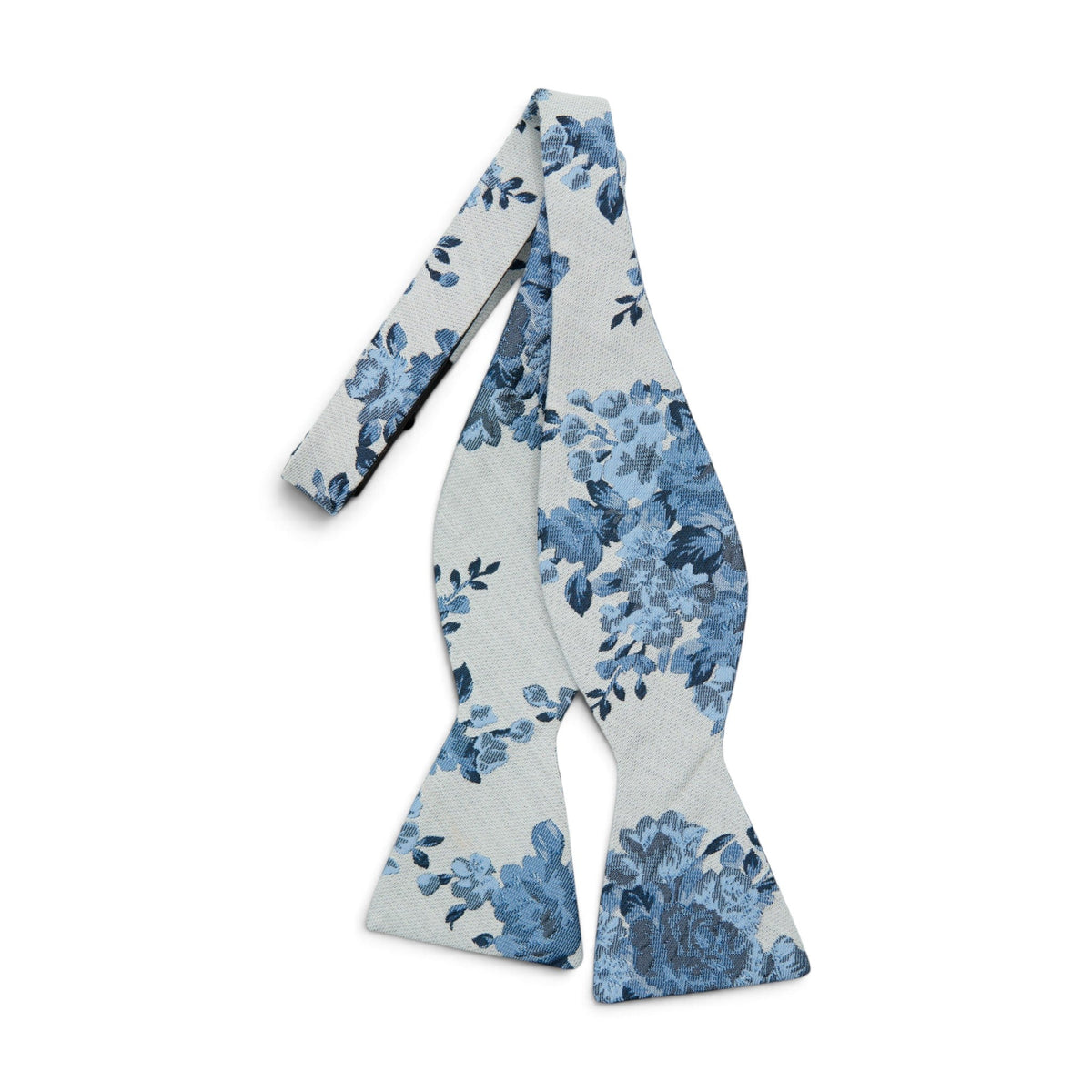Men's self-tie bow tie with light blue floral print on pale fabric
