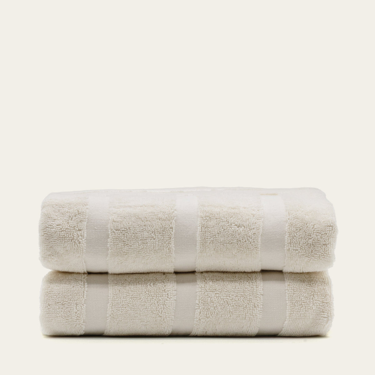 Australian cotton towels, folded cream towels with repeating texture blocks